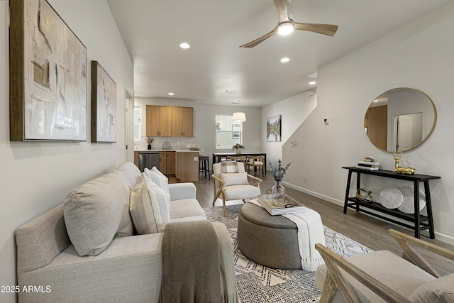 living room with ceiling fan and hardwood / wood-style floors