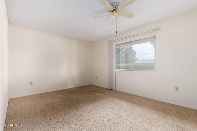 spare room featuring a ceiling fan, a textured ceiling, and carpet flooring