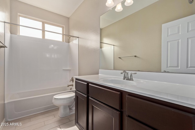 full bath with shower / washtub combination, vanity, toilet, and wood finished floors