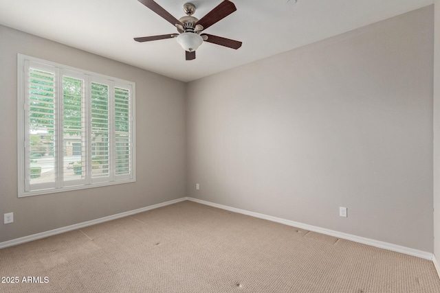 unfurnished room with light carpet, ceiling fan, and baseboards