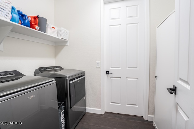 washroom with dark hardwood / wood-style flooring and independent washer and dryer