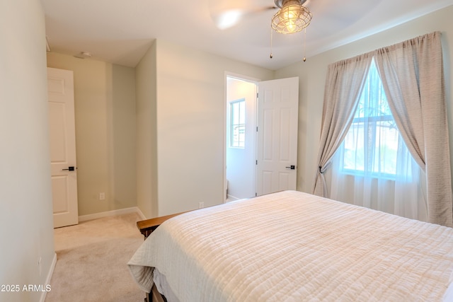 bedroom featuring ceiling fan and light carpet