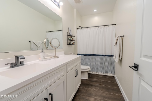 bathroom featuring vanity, a shower with shower curtain, and toilet