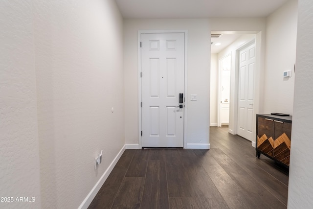 foyer entrance with dark wood-type flooring