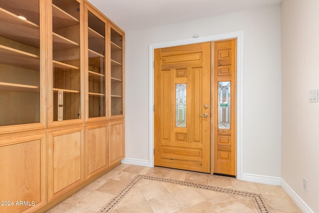 foyer with light tile patterned floors