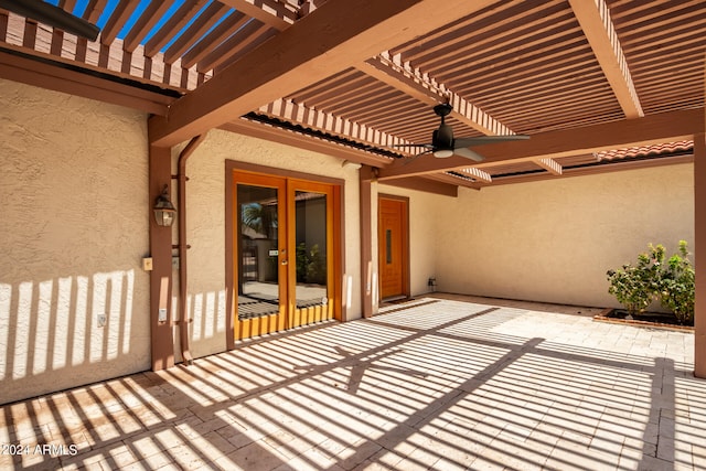 view of patio with ceiling fan and a pergola