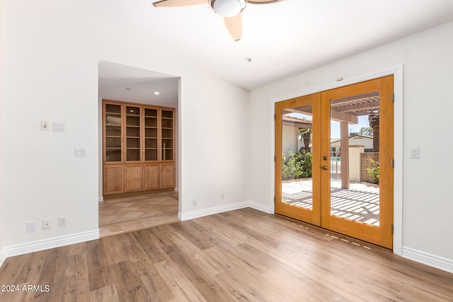 interior space with ceiling fan, light tile patterned floors, and french doors