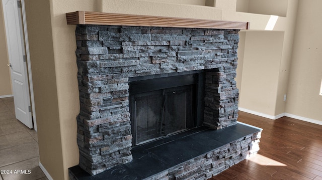 details featuring hardwood / wood-style flooring and a fireplace