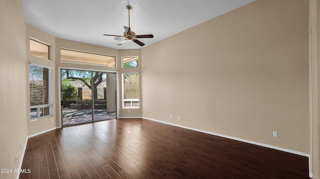 unfurnished room featuring ceiling fan and dark hardwood / wood-style floors