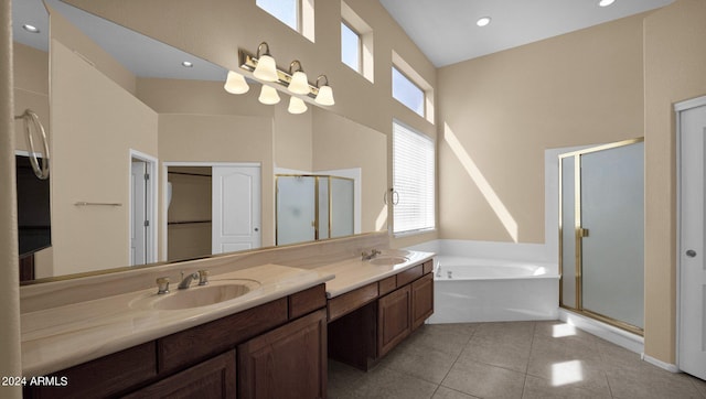 bathroom with vanity, tile patterned floors, and shower with separate bathtub