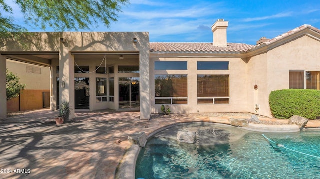 view of swimming pool with a patio area