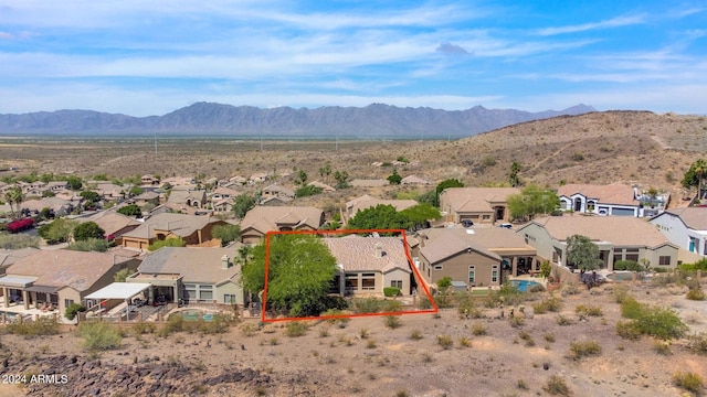 birds eye view of property with a mountain view