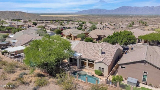 birds eye view of property with a mountain view