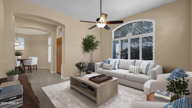 living room featuring light tile patterned floors and ceiling fan