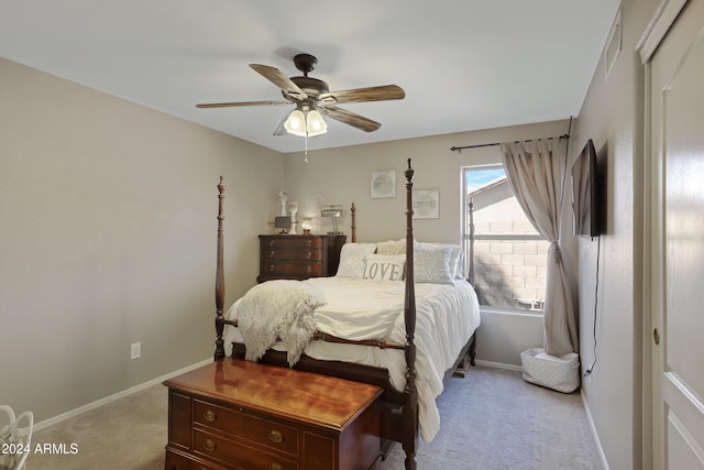 bedroom with ceiling fan and light carpet