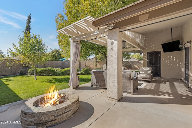 view of patio / terrace with an outdoor living space with a fire pit