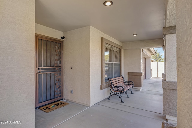 view of exterior entry featuring a porch