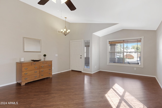 living room with ceiling fan with notable chandelier, lofted ceiling, and dark wood-type flooring