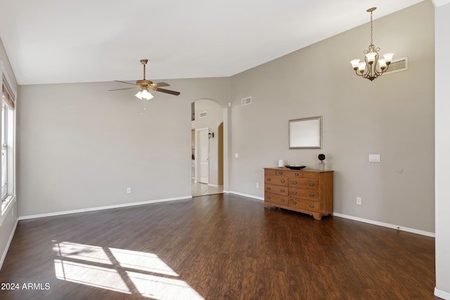 unfurnished room with dark hardwood / wood-style floors, ceiling fan with notable chandelier, and high vaulted ceiling