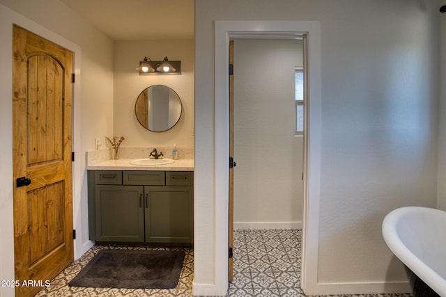 1014 Etta Ln, Show Low, AZ 85901 - bathroom featuring baseboards, a freestanding tub, and vanity