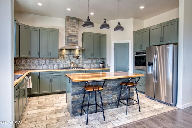 1014 Etta Ln, Show Low, AZ 85901 - kitchen featuring appliances with stainless steel finishes, wall chimney exhaust hood, decorative backsplash, recessed lighting, and wood counters