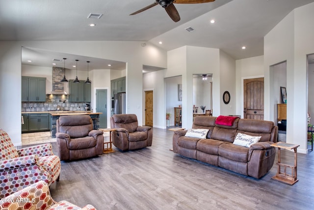 1014 Etta Ln, Show Low, AZ 85901 - living room featuring a ceiling fan, light wood-type flooring, recessed lighting, and high vaulted ceiling