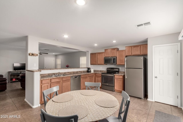 kitchen with visible vents, a sink, recessed lighting, appliances with stainless steel finishes, and light tile patterned flooring