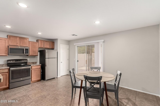 kitchen featuring visible vents, baseboards, light countertops, recessed lighting, and stainless steel appliances