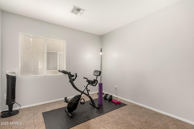 workout area featuring tile patterned floors, baseboards, and visible vents