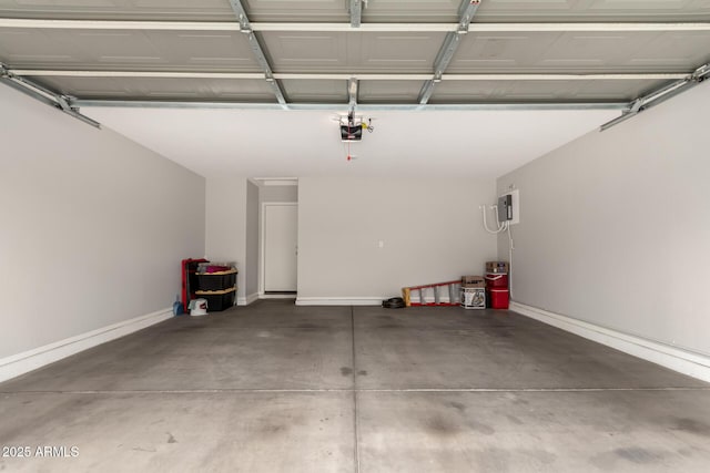 garage featuring baseboards and a garage door opener