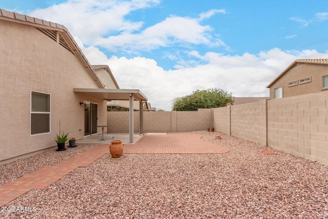 view of yard with a patio and a fenced backyard