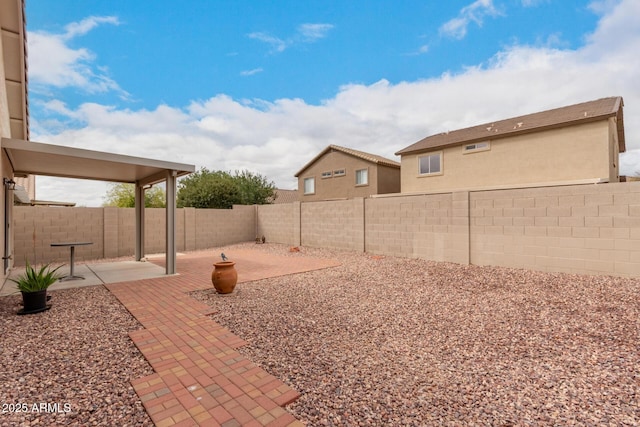 view of yard featuring a patio area and a fenced backyard