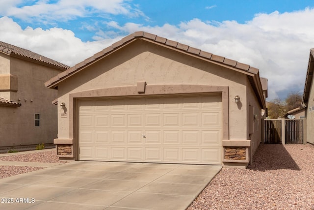 exterior space with concrete driveway and fence