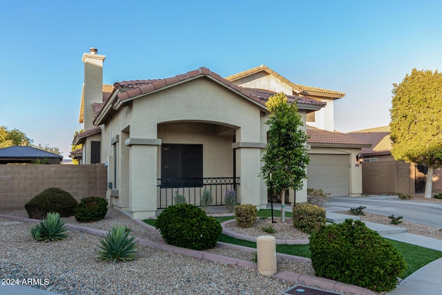 mediterranean / spanish-style house featuring a garage