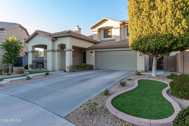 mediterranean / spanish house featuring a garage