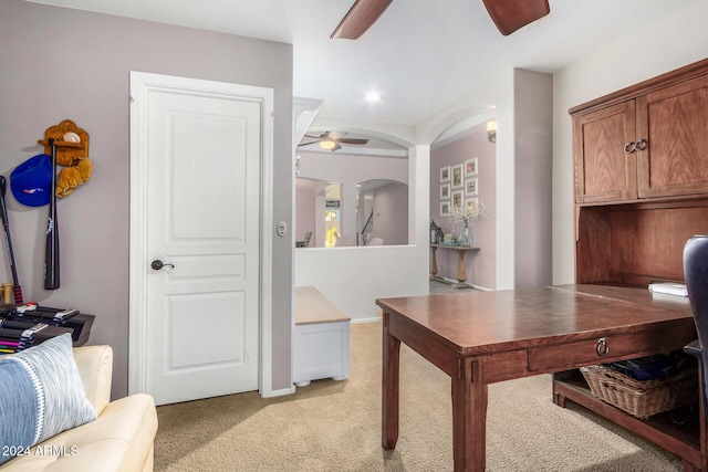 home office featuring ceiling fan and light carpet