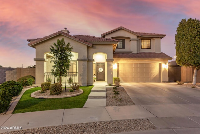 mediterranean / spanish-style house featuring a garage