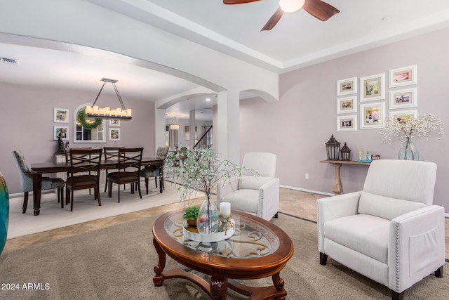 living room with carpet and ceiling fan