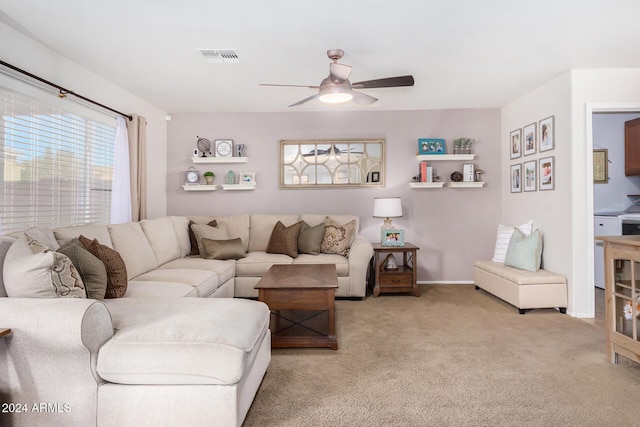 living room with light carpet and ceiling fan