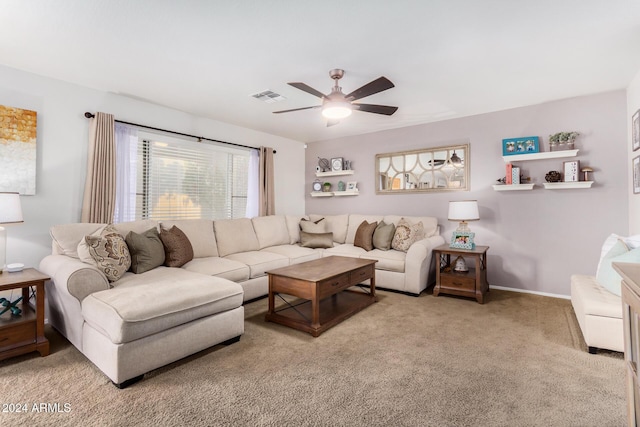 living room featuring carpet flooring and ceiling fan