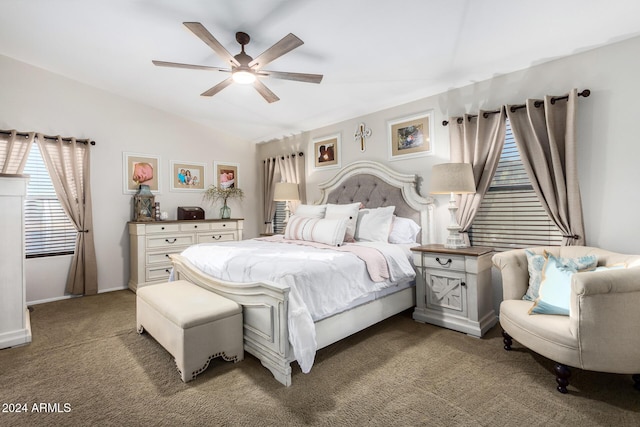 bedroom featuring dark colored carpet, ceiling fan, and lofted ceiling