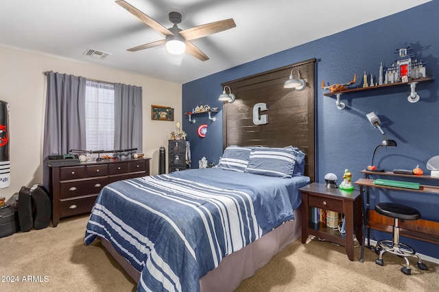 bedroom with ceiling fan and light carpet