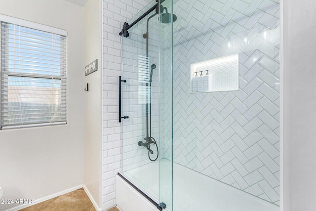 bathroom with tile patterned floors and enclosed tub / shower combo