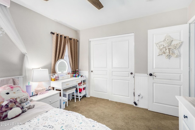 bedroom featuring ceiling fan, carpet floors, and a closet