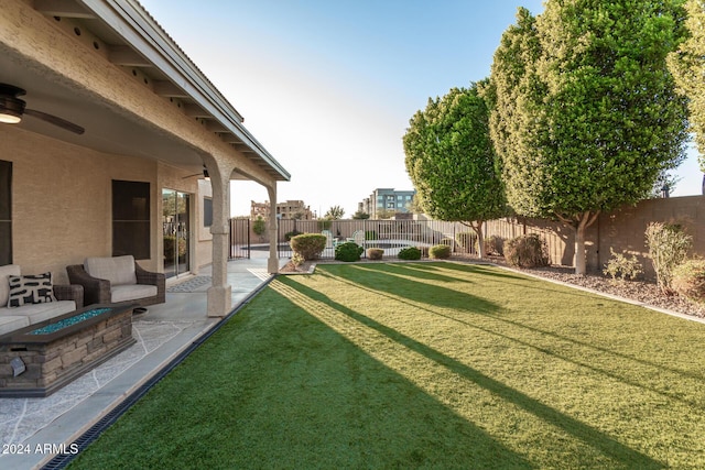 view of yard with an outdoor fire pit and a patio area