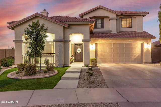 mediterranean / spanish-style house featuring a garage