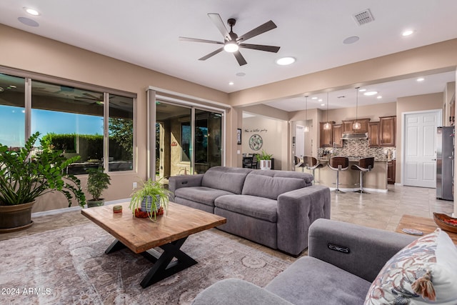 living room with ceiling fan