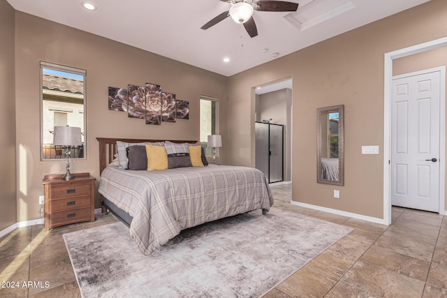 bedroom with multiple windows, a barn door, and ceiling fan