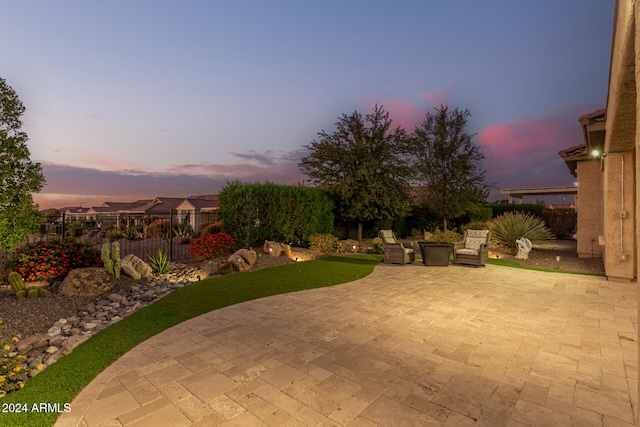 view of patio terrace at dusk