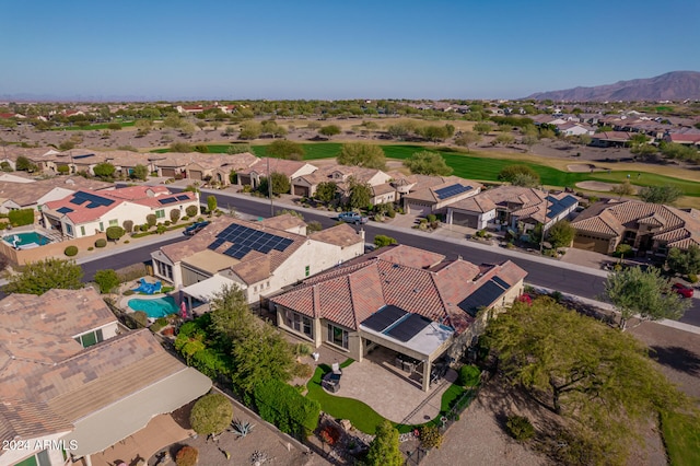 birds eye view of property with a mountain view